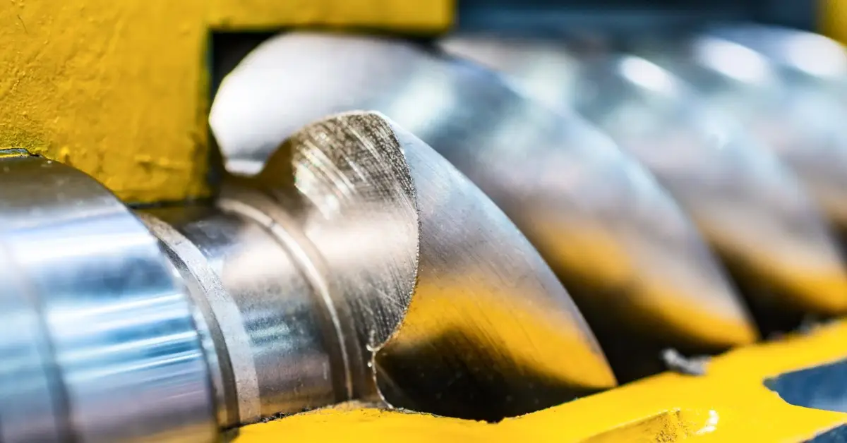 How Rotary Screw Air Compressors Benefit Energy Applications - US Air Compressor A close up of a cross section of a rotary screw air compressor, showing the rotary screw inside.
