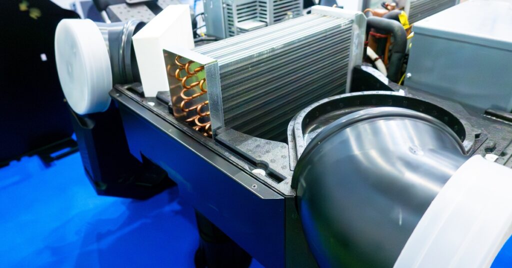 An inverter compressor sitting in a ventilation unit with other pieces for active thermodynamic recovery.